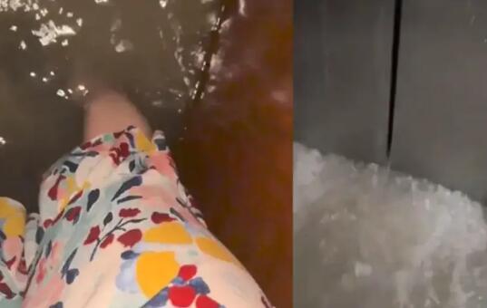 女子深夜乘電梯暴雨涌入被困1小時 實在太驚險了